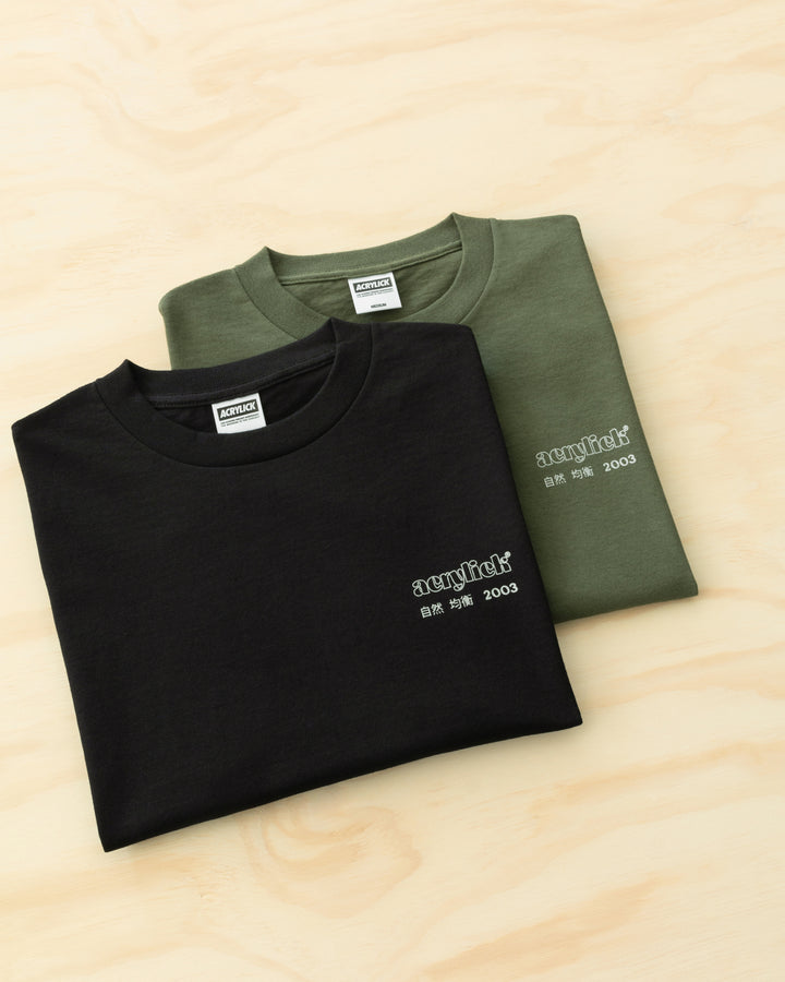 Green sakura branch in bloom, symbolizing rarity, growth, and natural balance. Acrylick Zen Capsule Tee.