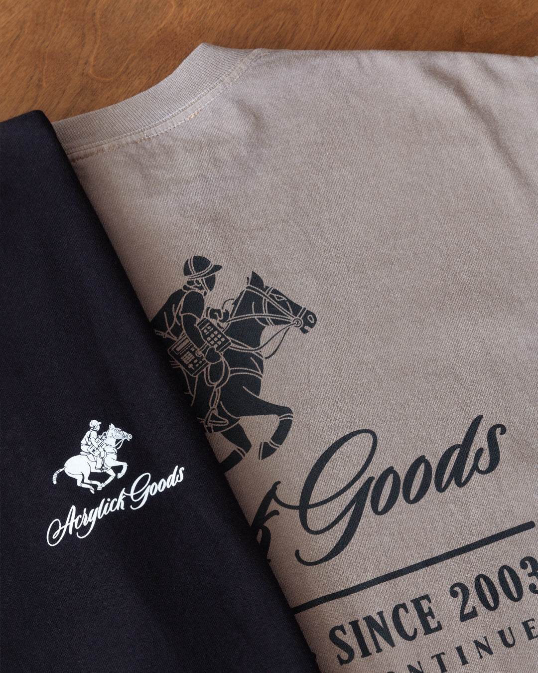 Illustration of a polo player riding a horse while holding an MPC beat machine, blending tradition, music culture with the words Acrylick Goods, Beat Society since 2003, the tradition continues.