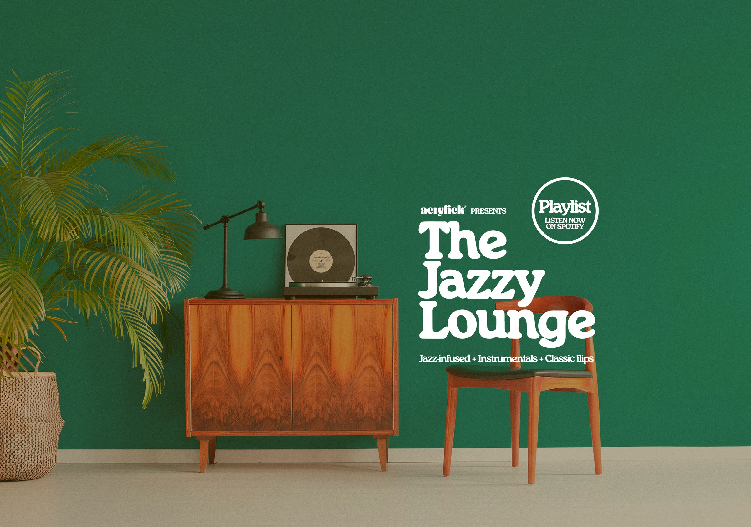 Decorative interior with a wooden cabinet, chair, and plant against a green wall with 'The Jazzy Lounge' branding.