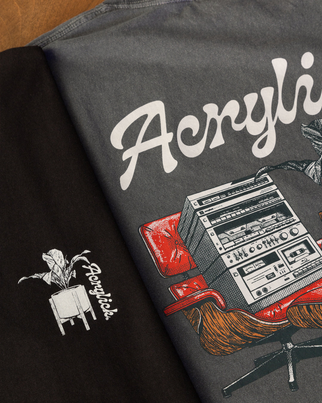 Mid-century style lounge chair holding a vintage hi-fi stereo, paired with a peace lily in a modern planter, representing relaxed listening and thoughtful living.