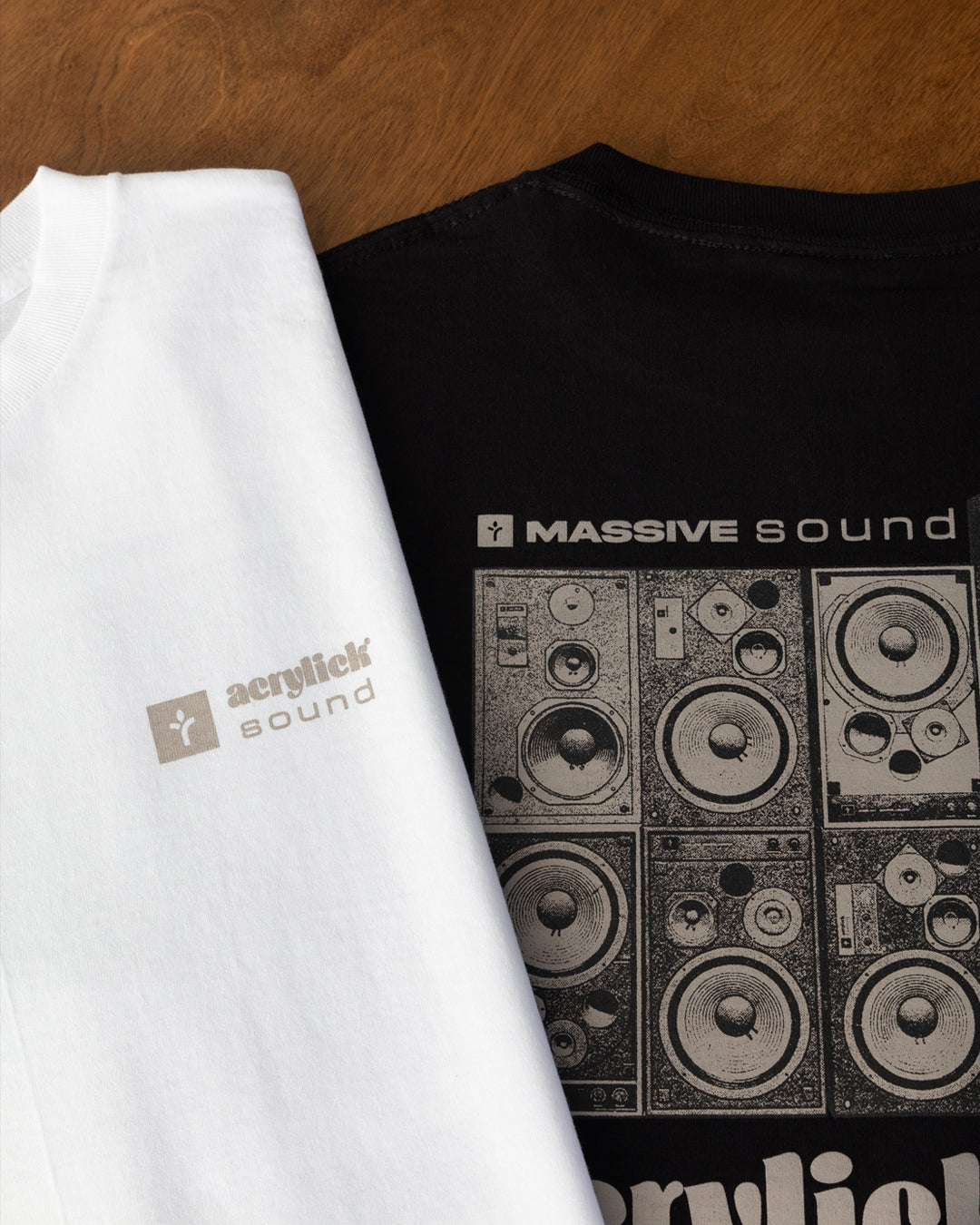 Graphic of a stacked wall of vintage analog speakers with text reading “Massive Sound,” emphasizing classic audio culture and durability.