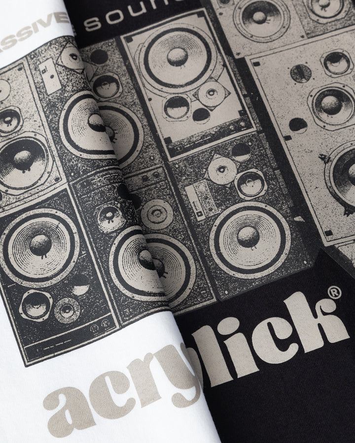 Graphic of a stacked wall of vintage analog speakers with text reading “Massive Sound,” emphasizing classic audio culture and durability.