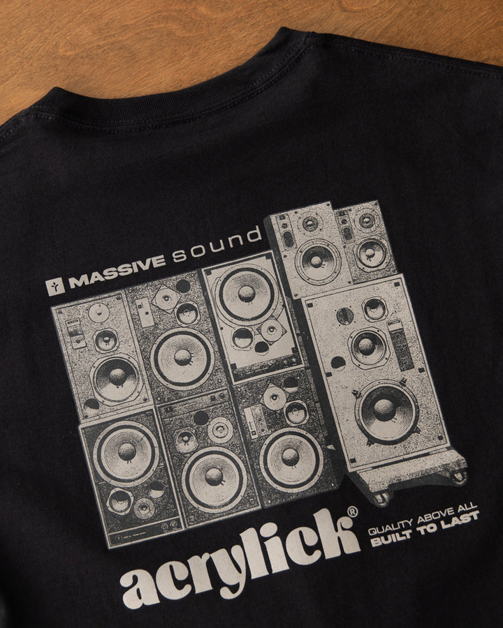 Graphic of a stacked wall of vintage analog speakers with text reading “Massive Sound,” emphasizing classic audio culture and durability.