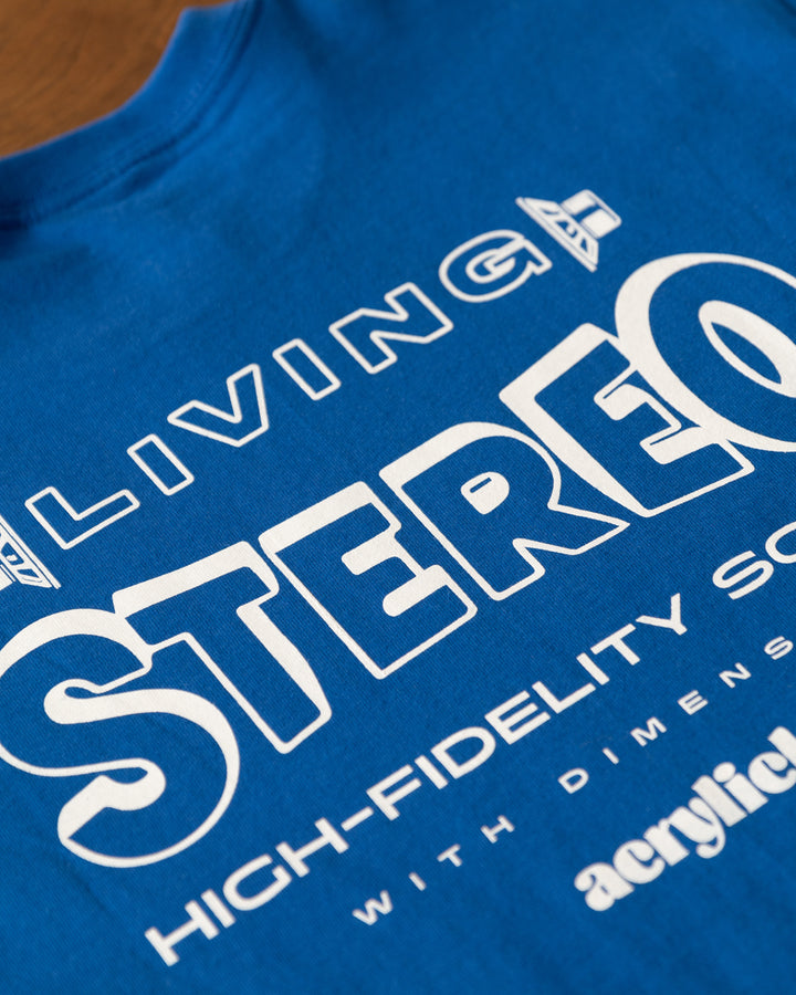 Side-view illustration of stereo speakers facing outward with the words “Living Stereo,” symbolizing immersive, high-fidelity sound with Acrylick logo.