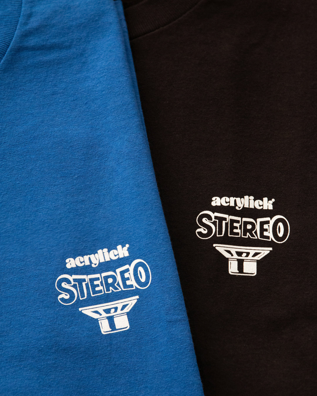 Side-view illustration of stereo speakers facing outward with the words “Living Stereo,” symbolizing immersive, high-fidelity sound with Acrylick logo.