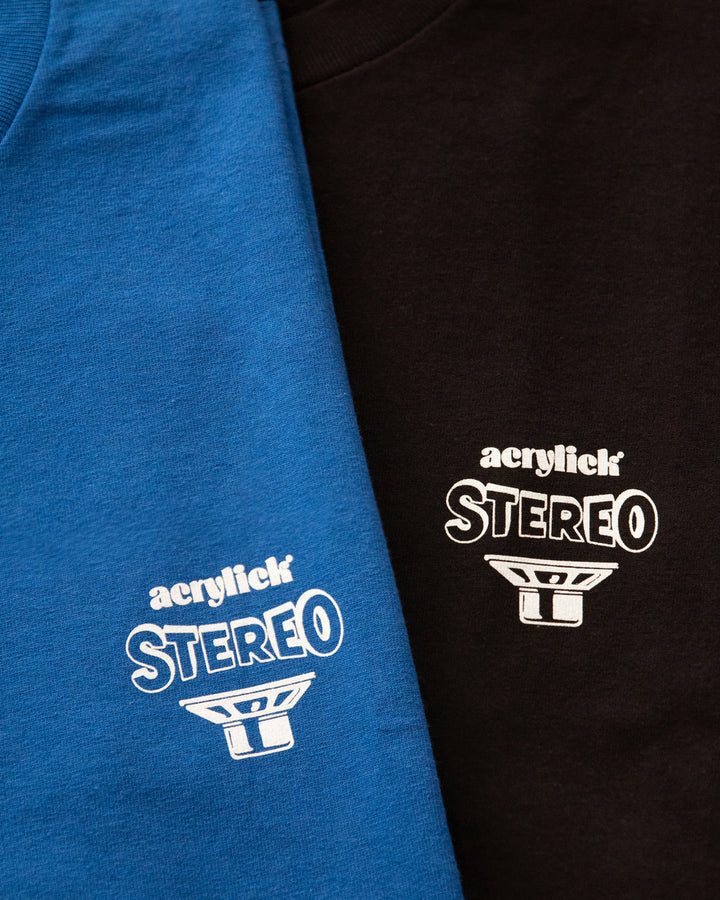 Side-view illustration of stereo speakers facing outward with the words “Living Stereo,” symbolizing immersive, high-fidelity sound with Acrylick logo.